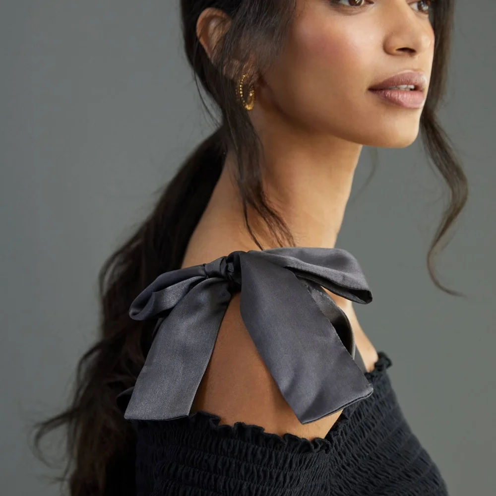Anthropologie bow off shoulder smocked top black